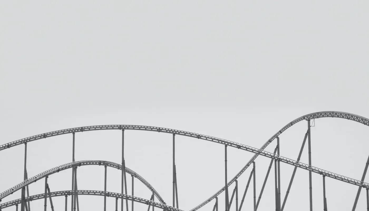 black and white photo of roller coaster track