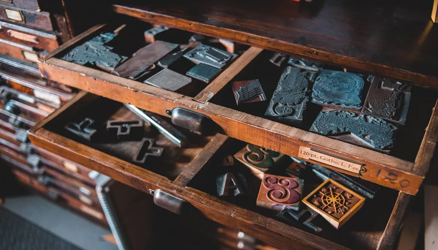 photo of stamps and lettering in a drawer