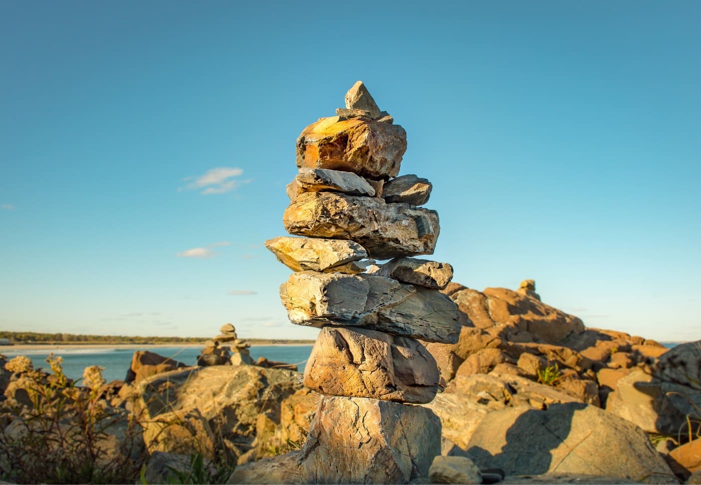 photo of stacked rocks on beach