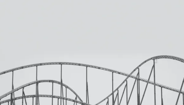 black and white photo of roller coaster track
