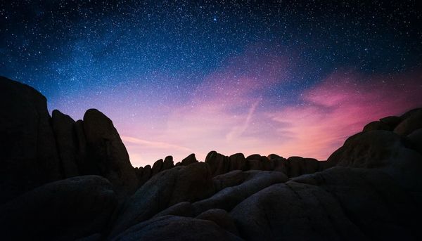 photo of night sky over mountains